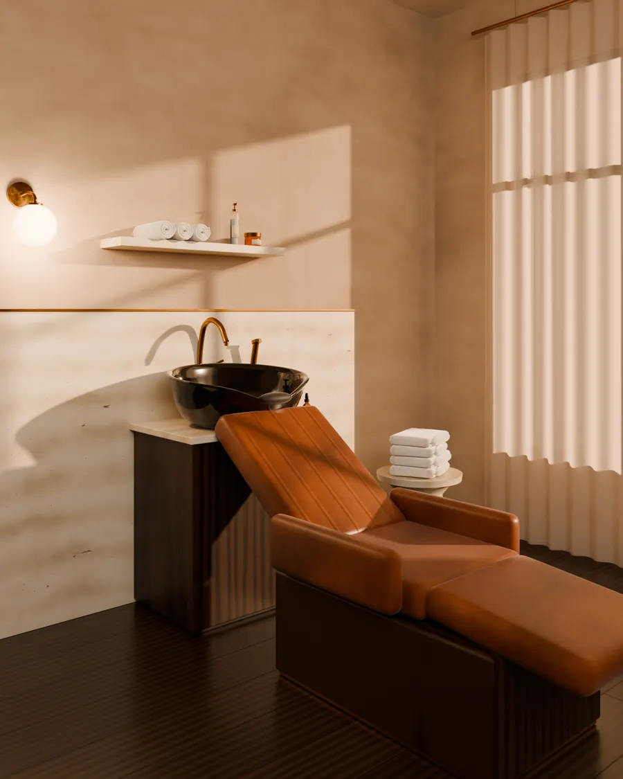 A black wash basin with a reclined chair and folded towels